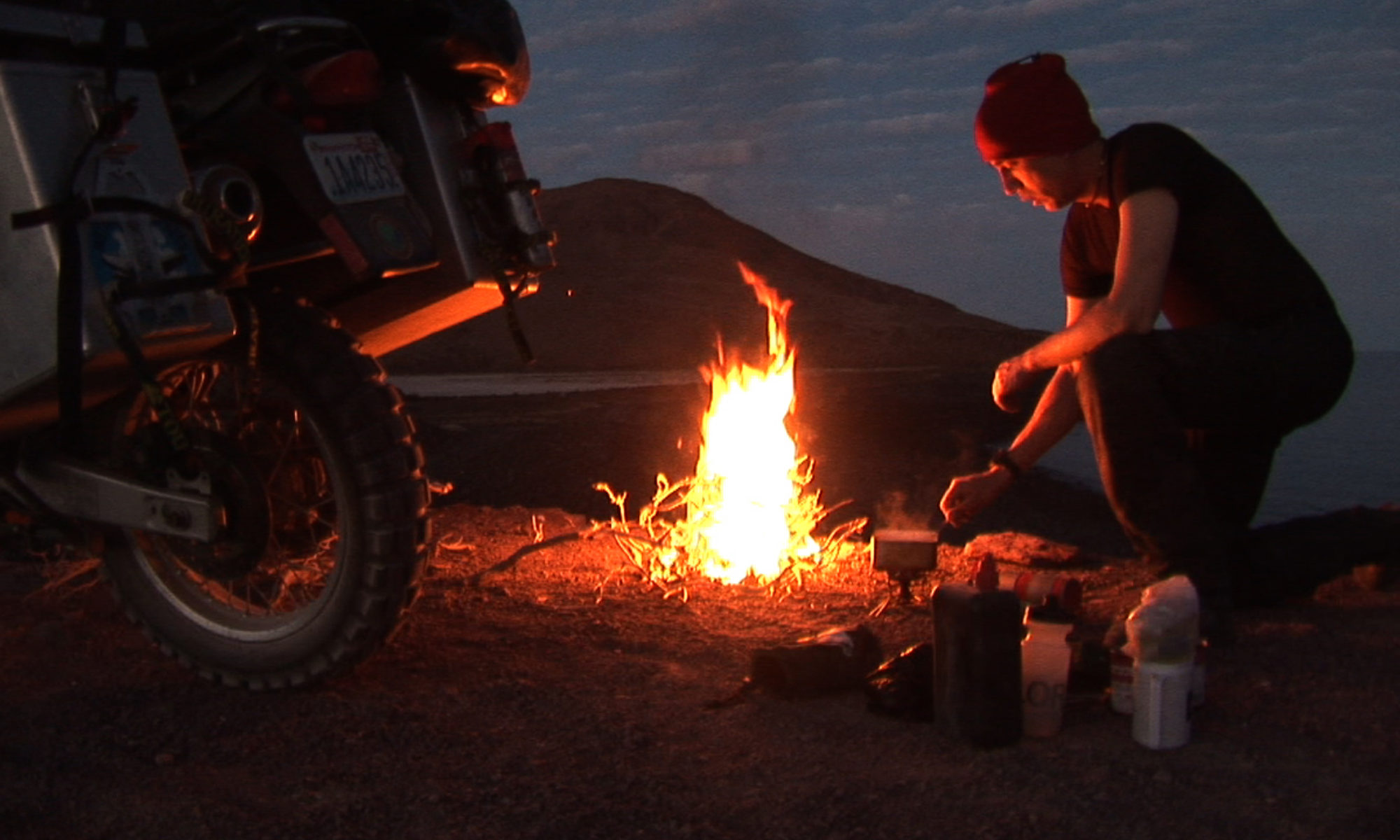 Sterling Noren motorcycle camping with fire Baja Mexico