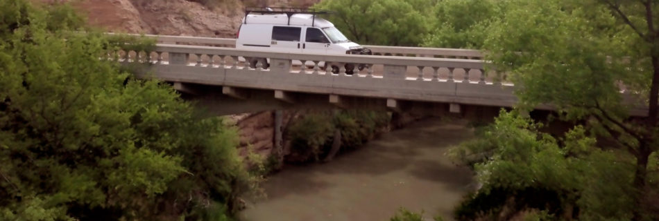 Van crossing Gila River bridge