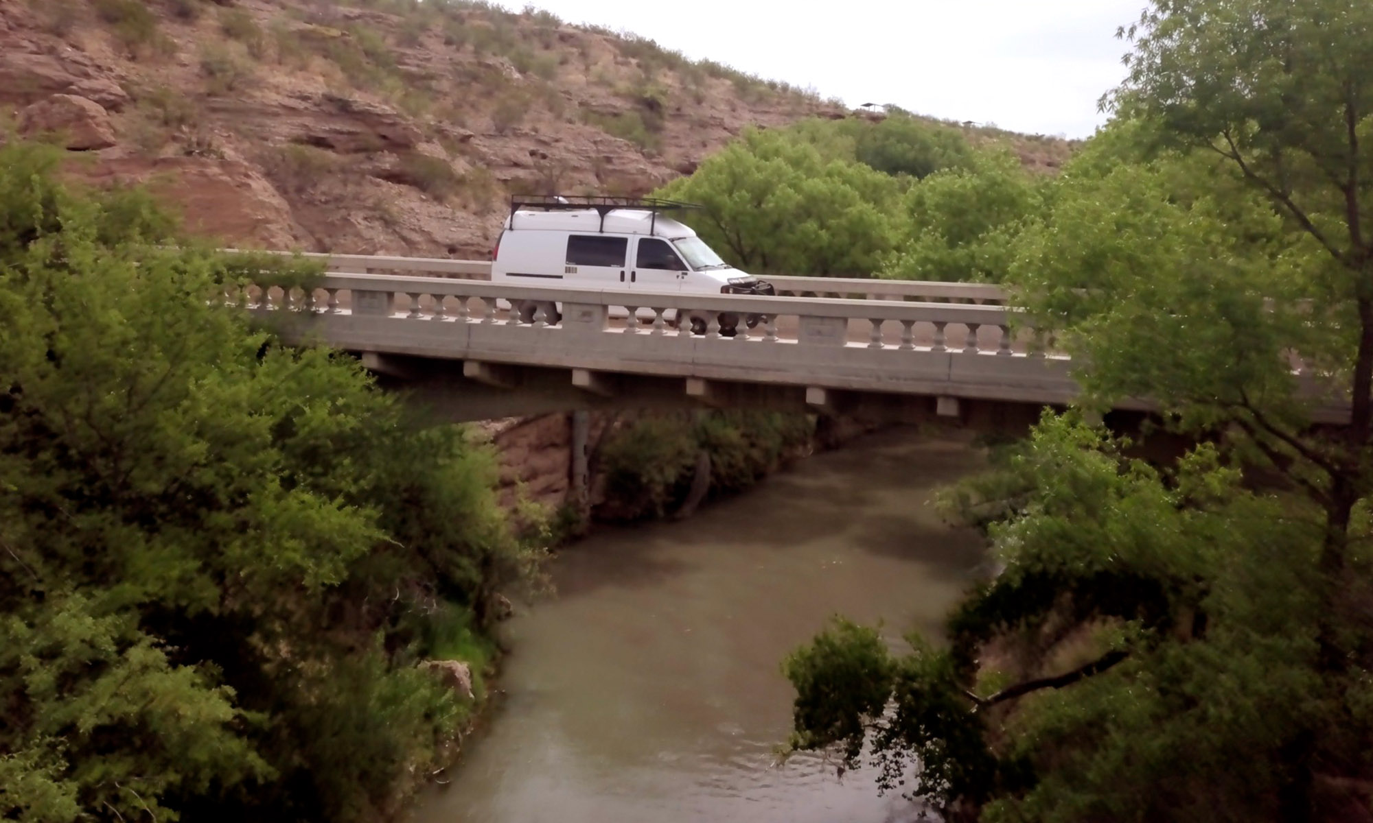 Van crossing Gila River bridge