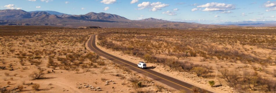 Van driving paved road into Buenos Arires National Wildlife Refuge