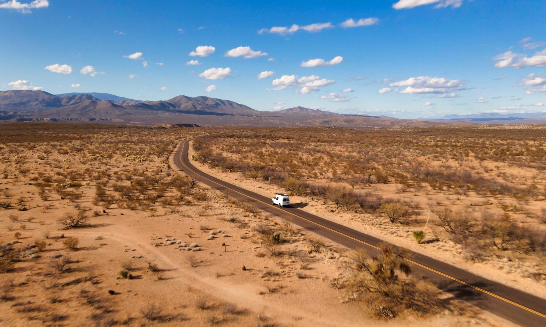 Van driving paved road into Buenos Arires National Wildlife Refuge