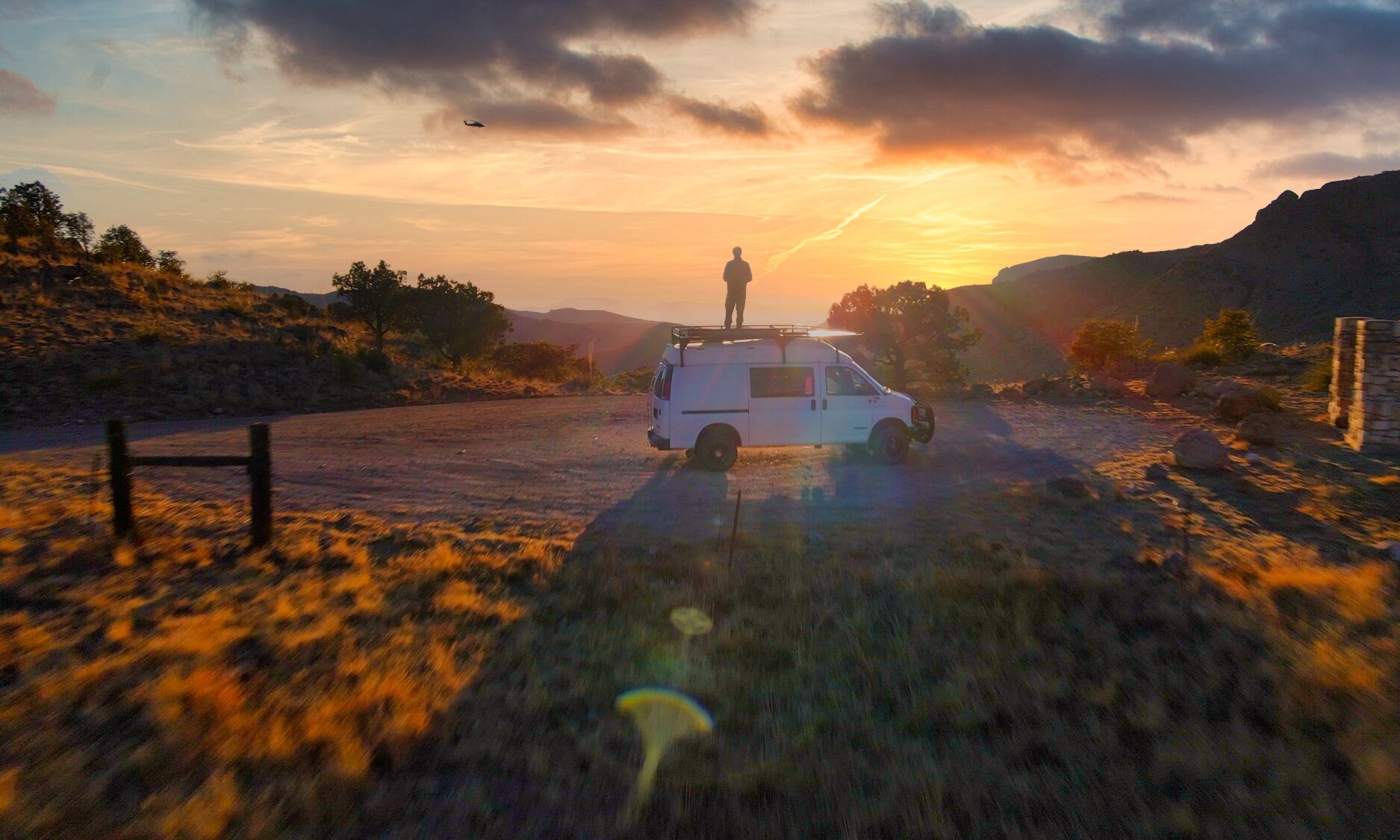 Sterling Noren on van roof Geronimo Trail Arizona