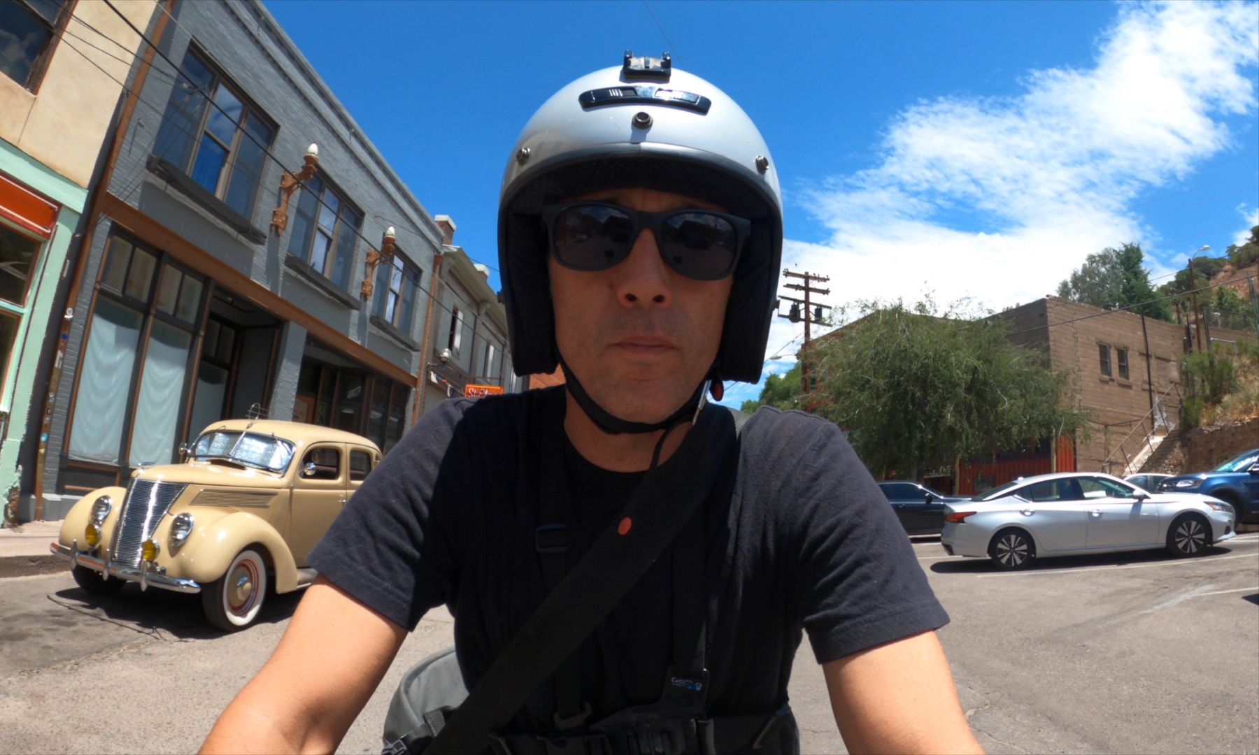 Sterling Noren riding vintage motorcycle in Bisbee Arizona