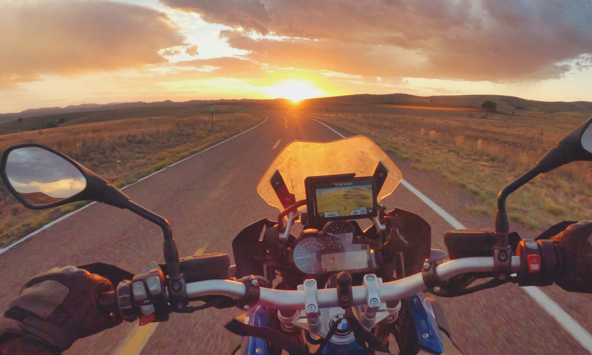 Riding solo into the sunset on a motorcycle in New Mexico