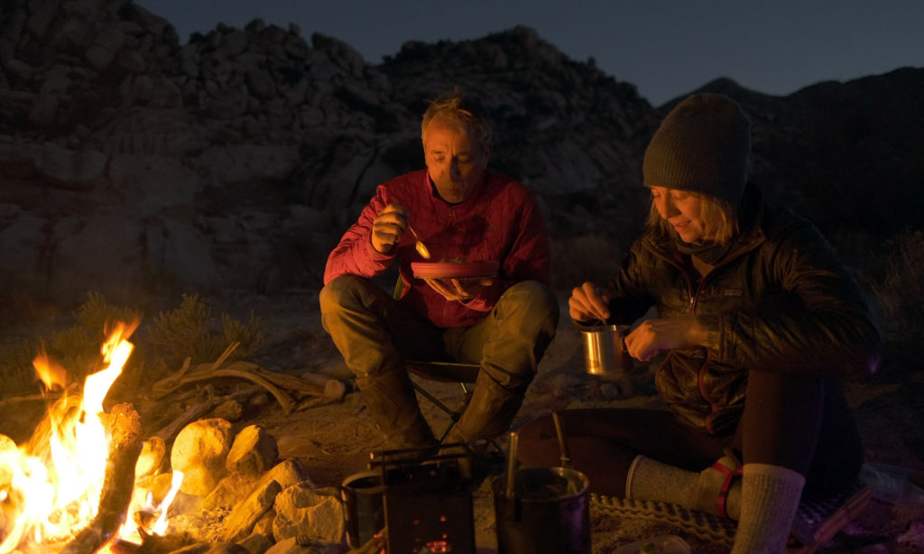 Sterling and Eva eating camp dinner