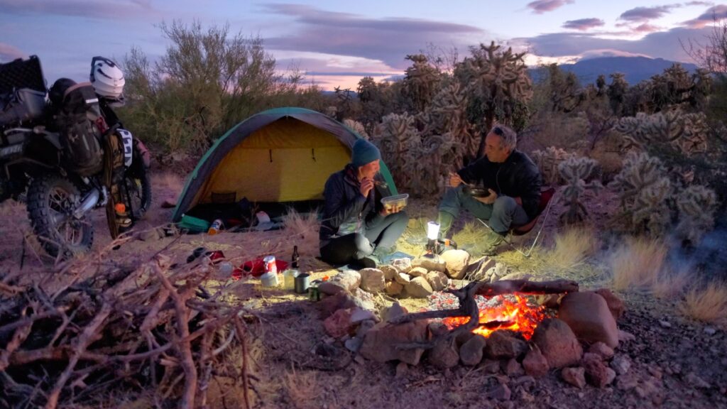 Sterling Noren and Eva Rupert cooking Thanksgiving dinner in the desert