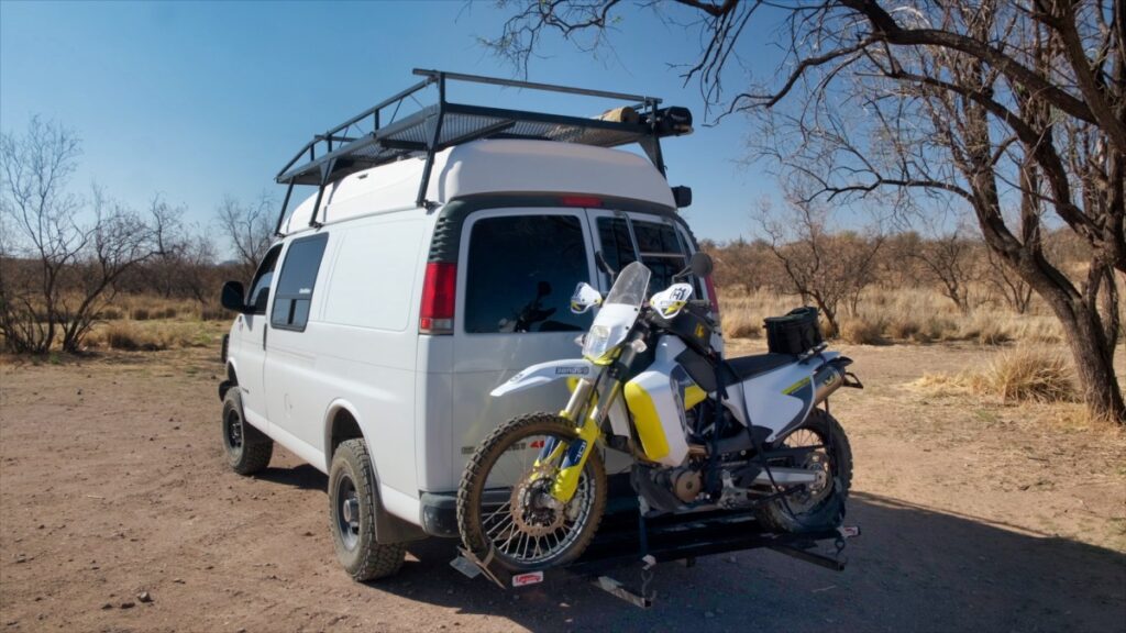 Chevrolet 4x4 Quigley van with motorcycle in Santa Rita Mountains Arizona