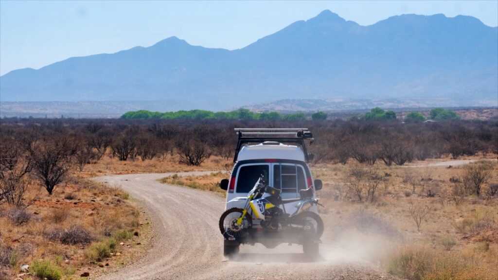 Chevrolet 4x4 Quigley van with motorcycle in Santa Rita Mountains Arizona