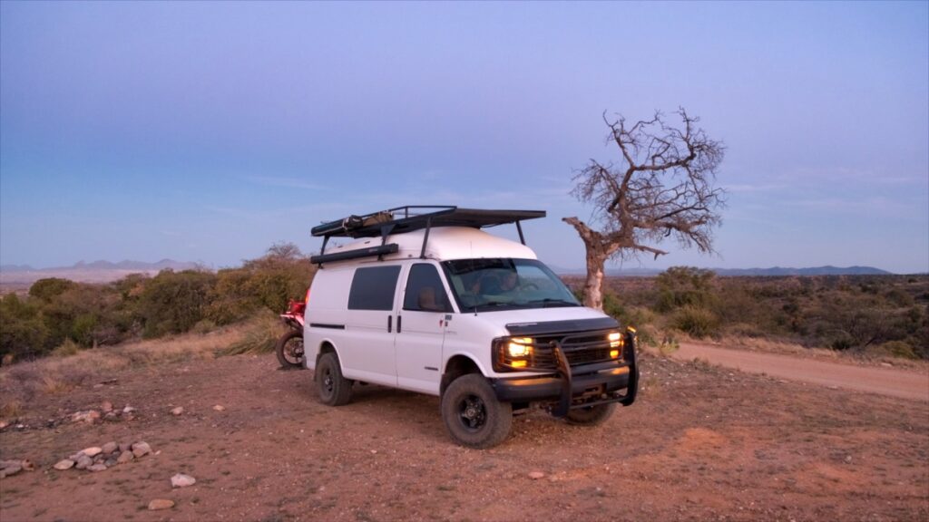 Chevrolet 4x4 Quigley van with motorcycle in Santa Rita Mountains Arizona