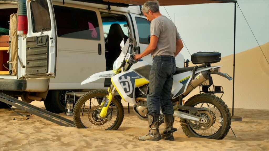 Sterling Noren with Husqvarna 701 motorcycle and Chevrolet Express Quigley 4x4 van Imperial Sand Dunes