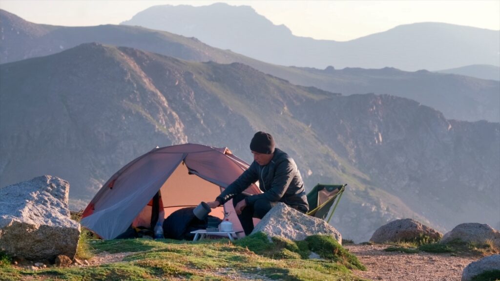 Sterling Noren making coffee at camp on Rollins Pass in Colorado