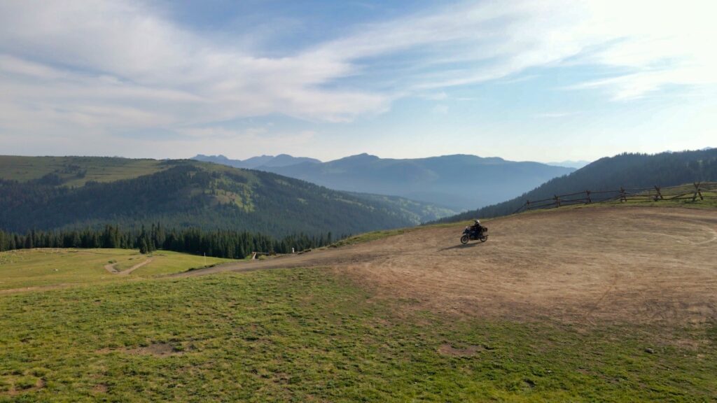 Solo motorcyclist Sterling Noren on top of Ptarmigan Pass Colorado