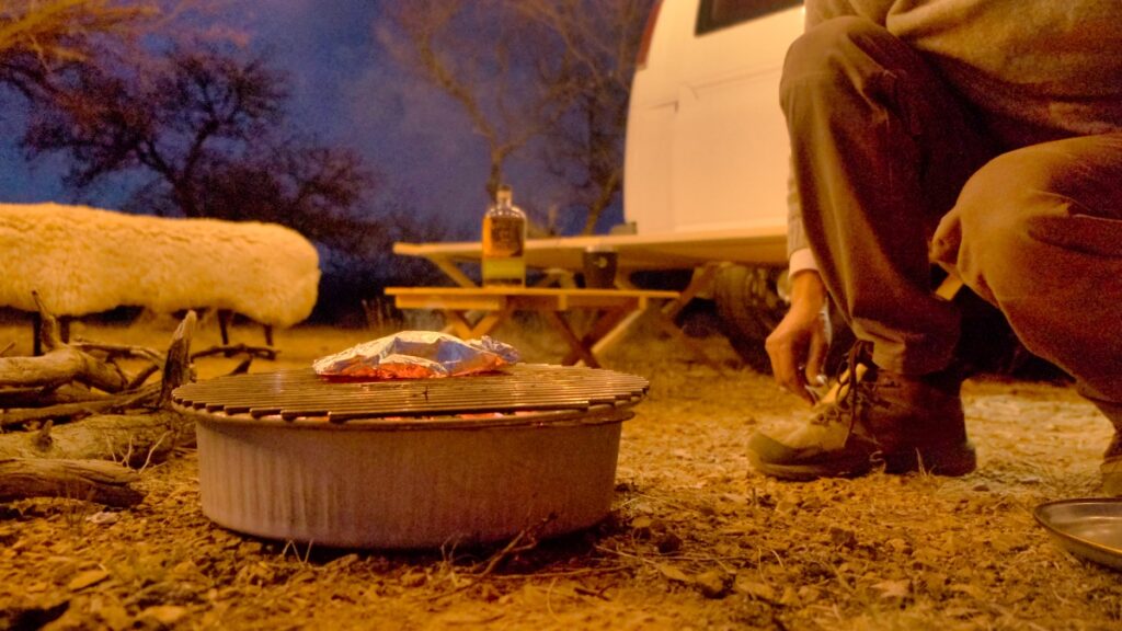 cooking salmon in tin foil over fire