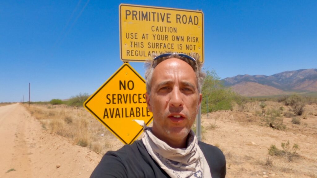 Sterling Noren with primitive road sign