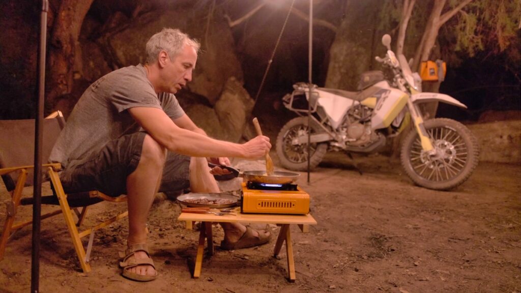 Sterling Noren motorcycle camping and cooking at night