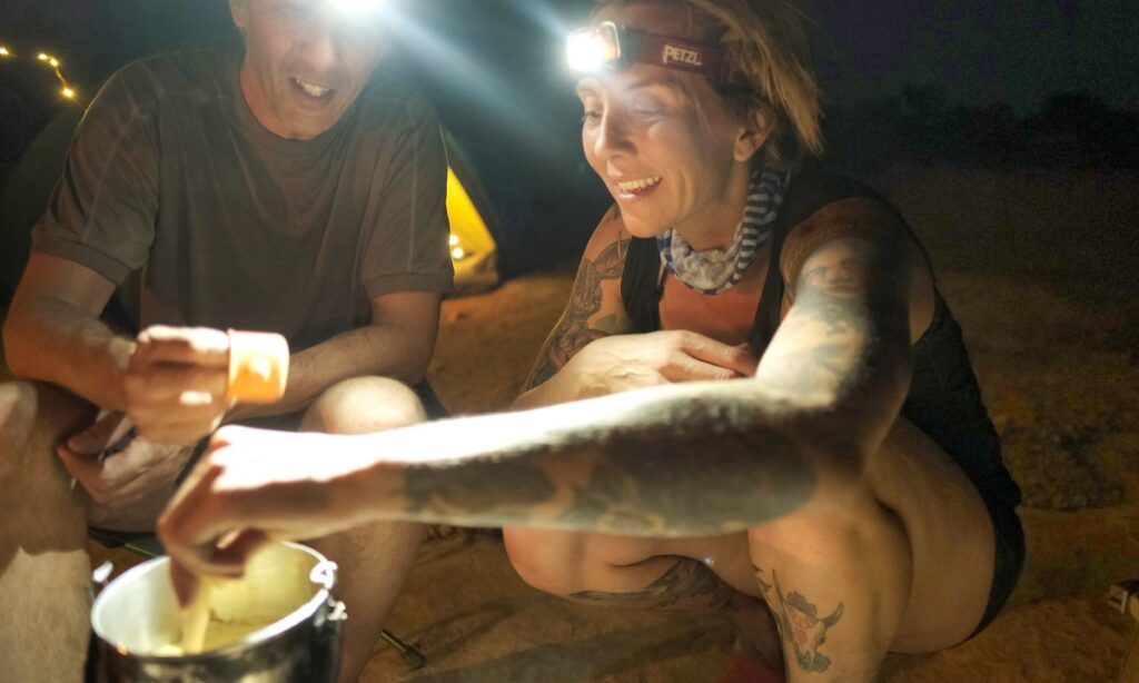 Sterling Noren and Eva Rupert motorcycle camping on Muley Point in Utah