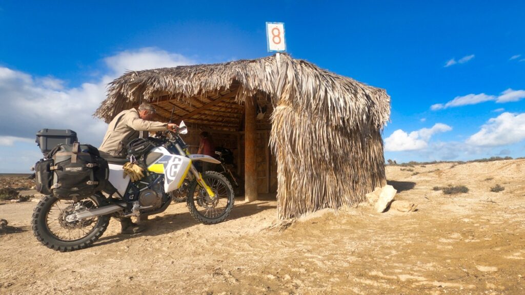 Motorcycle camping in a beach palapa in Baja California