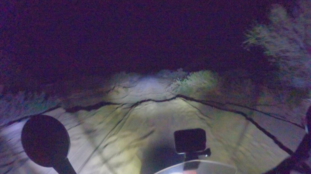 Motorcycling at night on sandy road in Baja California