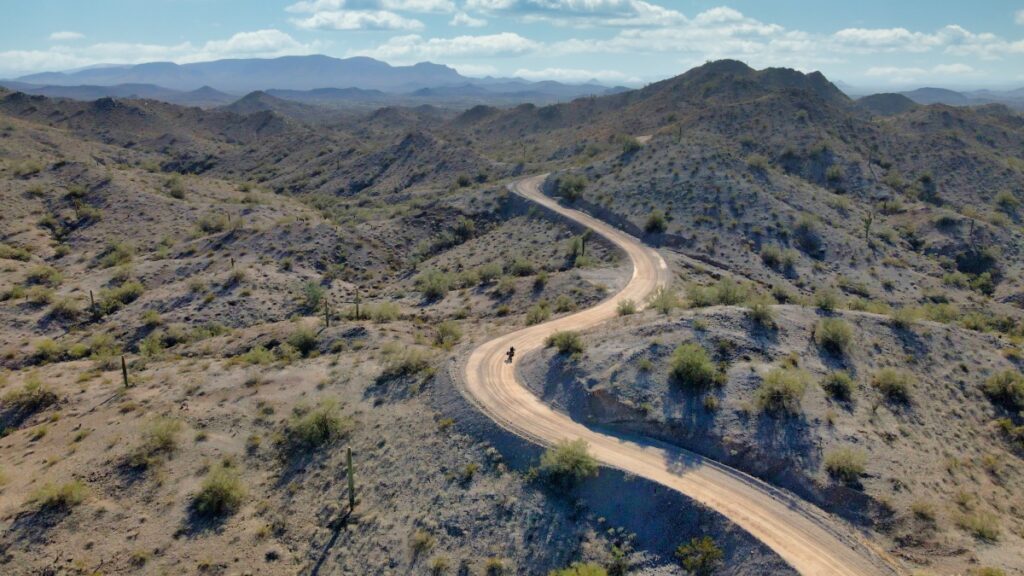 Sterling Noren riding motorcycle on Agua Caliente Road in Arizona