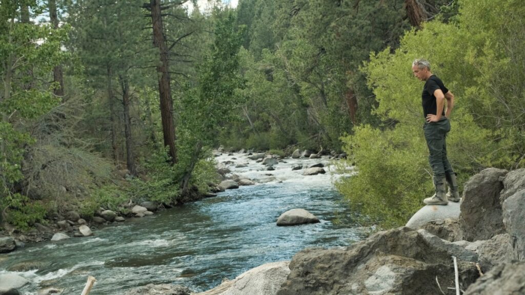 Sterling Noren by creek in Sierra Nevadas