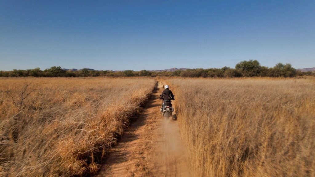 Sterling Noren riding BMW GS motorcycle in Buenos Aires National Wildlife Refuge 2020