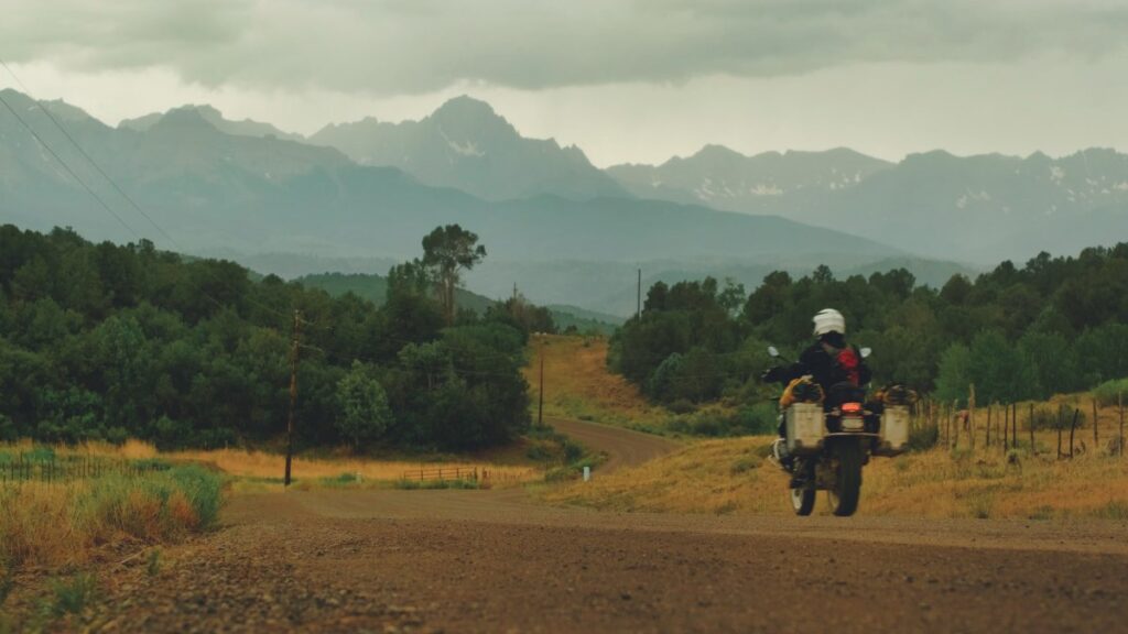 Sterling Noren riding BMW GS motorcycle in Ridgway Colorado