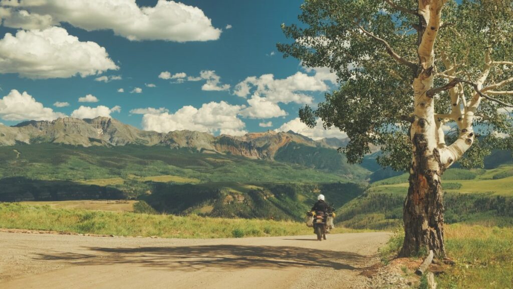 Sterling Noren riding BMW GS motorcycle in Colorado