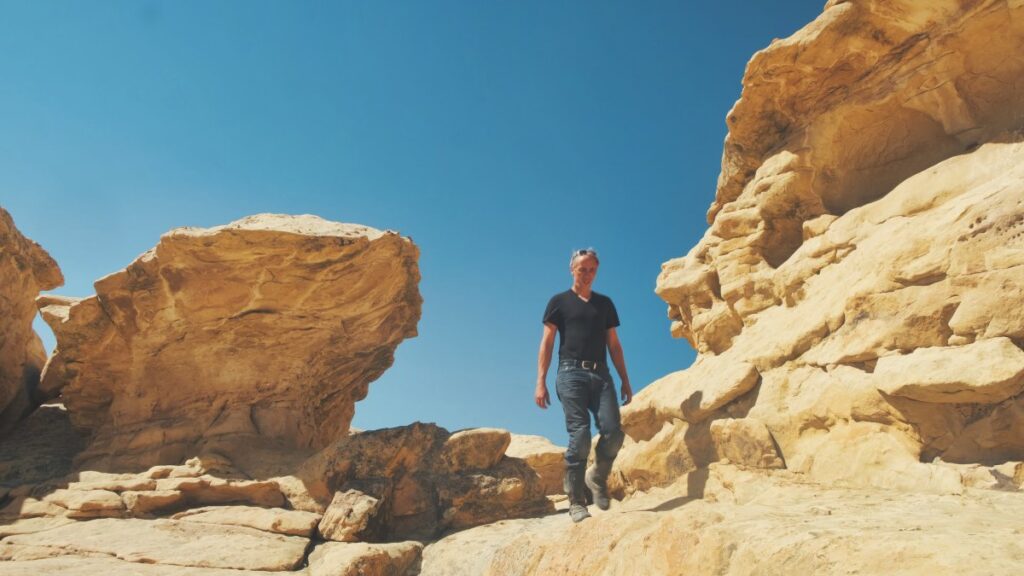 Sterling Noren exploring rocks in New Mexico