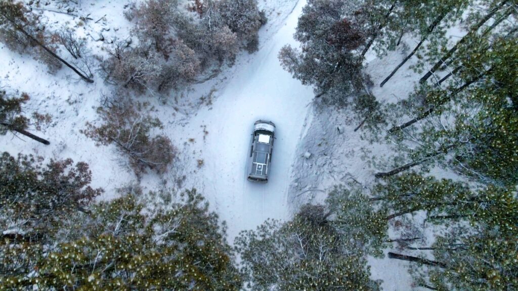 aerial view of van driving up Mount Lemmon near Tucson in winter