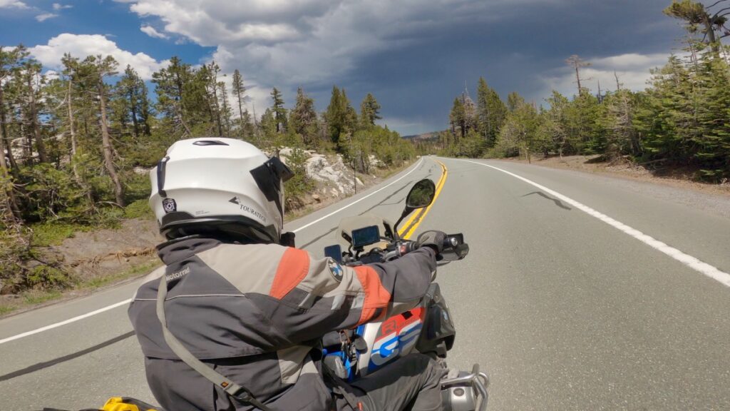 Sterling Noren with BMW motorcycle riding in Sierra Nevada mountains