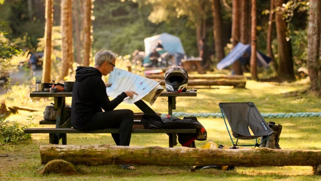 Sterling Noren looking at a map in BC, Canada