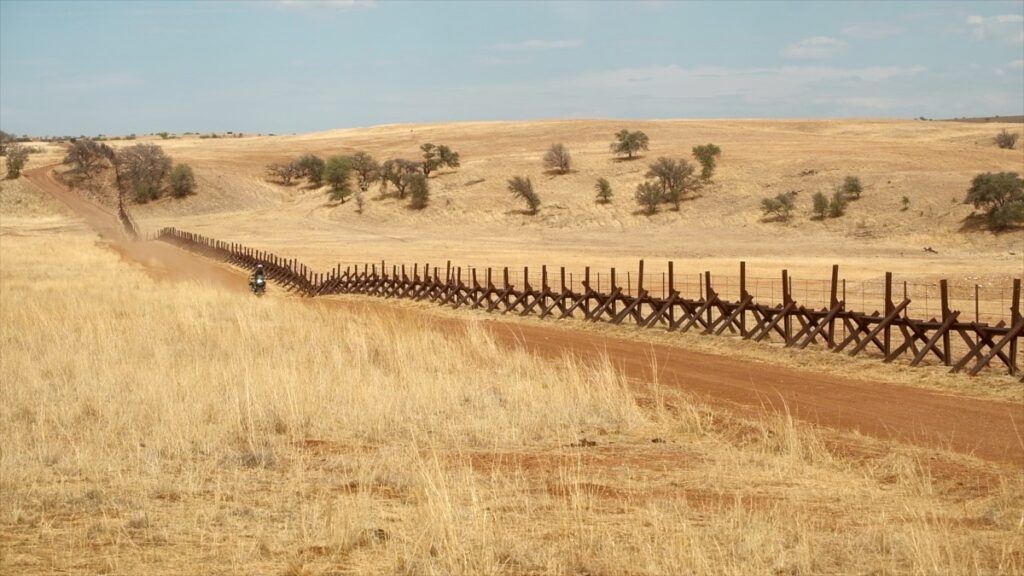 US/Mexico border wall and road
